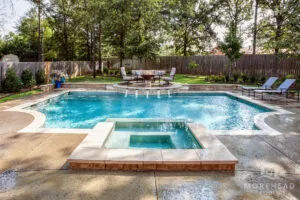 Swimming pool with home spa, water features and firepit
