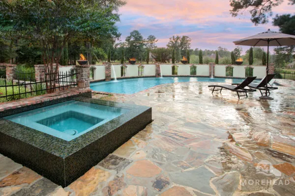 Swimming pool with with water features and home spa