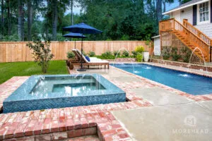 Cocktail swimming pool with water features and home spa