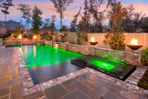 Geometric pool with green pool lights & Fire bowls