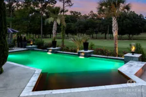 Geometric swimming pool with fire lanterns