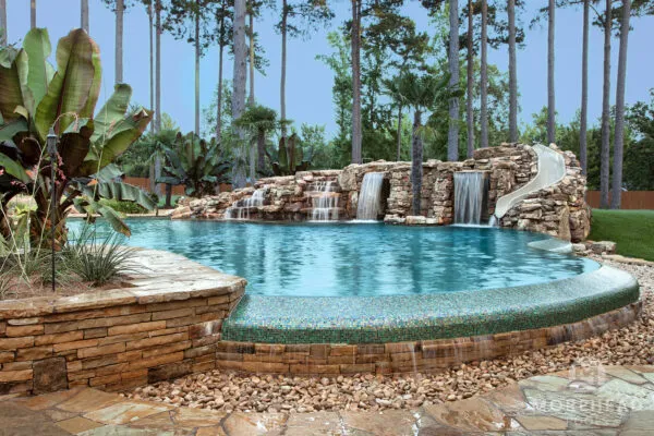 Luxury swimming pool with waterfalls and slide