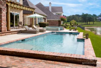 Geometric swimming pool with tanning ledge