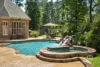 Luxury pool with water features and custom spa