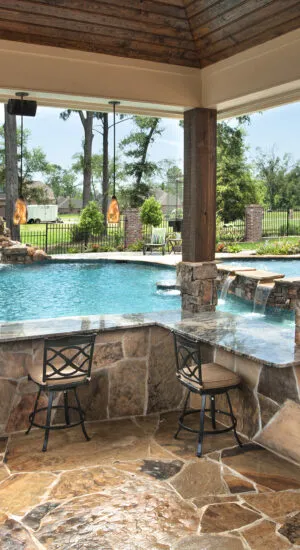 Outdoor kitchen with swim up pool bar