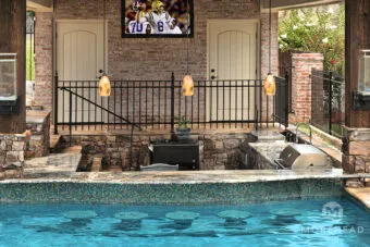 Outdoor kitchen with swim-up pool bar