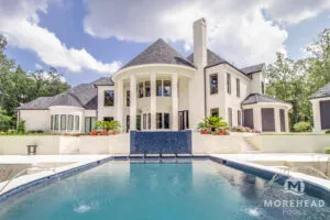 Mansion with custom luxury pool by Morehead Pools