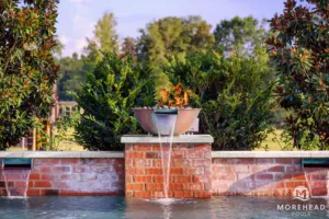 Fire feature and water feature around swimming pool