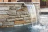 close up of a water feature in stone pool | Morehead Pools