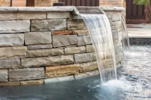 close up of a water feature in stone pool | Morehead Pools