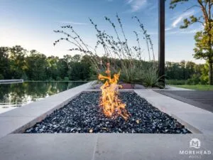 outside fire feature by the pool | Morehead Pools